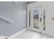 Bright entryway with elegant floors and a decorative glass front door at 2746 Heathgate Way, Land O Lakes, FL 34638