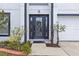 Elegant front door with decorative glass and manicured landscaping at 2746 Heathgate Way, Land O Lakes, FL 34638