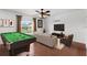 Entertaining game room featuring a pool table and cozy seating area at 2746 Heathgate Way, Land O Lakes, FL 34638
