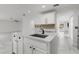 Bright, spacious kitchen featuring a large center island and stainless steel appliances and dark hardware at 2746 Heathgate Way, Land O Lakes, FL 34638