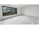 Bright, spacious living room boasts large windows and light marble flooring at 2746 Heathgate Way, Land O Lakes, FL 34638