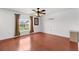 Cozy living room features wood floors and a view of the backyard at 2746 Heathgate Way, Land O Lakes, FL 34638