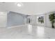 Bright and airy living room with elegant floors and large windows at 2746 Heathgate Way, Land O Lakes, FL 34638