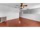 Open living room boasts sleek wood floors and classic ceiling fan at 2746 Heathgate Way, Land O Lakes, FL 34638