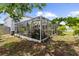 Enclosed patio with a fountain and landscaping offers a tranquil retreat at 2746 Heathgate Way, Land O Lakes, FL 34638