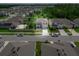 Overhead shot of a charming neighborhood showcasing a well-maintained home with lush greenery and manicured lawns at 3052 Living Coral Dr, Odessa, FL 33556
