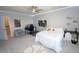 Bright bedroom featuring a ceiling fan, gaming setup, and modern decor at 3052 Living Coral Dr, Odessa, FL 33556