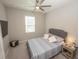 Cozy bedroom with neutral décor, comfortable bedding, and a ceiling fan at 3052 Living Coral Dr, Odessa, FL 33556