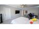Well-lit bedroom with a TV, work space, and comfortable gray beanbag at 3052 Living Coral Dr, Odessa, FL 33556
