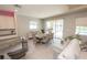 Bright dining room with table, seating for six, and sliding glass doors leading to the pool area at 3052 Living Coral Dr, Odessa, FL 33556