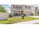 Inviting two-story home with covered porch and well-manicured front lawn at 3052 Living Coral Dr, Odessa, FL 33556
