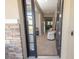 Welcoming foyer with tile flooring leading to a spacious living area at 3052 Living Coral Dr, Odessa, FL 33556