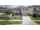 Charming two-story home boasts a well-manicured lawn, covered porch, and inviting curb appeal in a friendly neighborhood at 3052 Living Coral Dr, Odessa, FL 33556