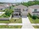 Beautiful two-story home with a well-kept lawn, covered porch, and a convenient two-car garage at 3052 Living Coral Dr, Odessa, FL 33556