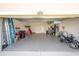 Neat garage with epoxy flooring, door to inside, and ample storage space at 3052 Living Coral Dr, Odessa, FL 33556