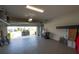 Spacious epoxy garage offering plenty of storage, a clean epoxy floor, and rear access at 3052 Living Coral Dr, Odessa, FL 33556