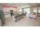 Modern kitchen featuring a center island with seating, stainless steel appliances, and ample lighting at 3052 Living Coral Dr, Odessa, FL 33556