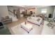 Open concept living area with kitchen, living room, and staircase at 3052 Living Coral Dr, Odessa, FL 33556