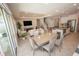 Open-concept living space with modern furnishings, tile flooring, and easy access to the outdoor area at 3052 Living Coral Dr, Odessa, FL 33556