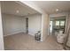 Open-concept room with modern decor, neutral paint, and tile floors at 3052 Living Coral Dr, Odessa, FL 33556