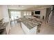 Open-concept kitchen and dining area offer seamless flow to the living space and outdoor views at 3052 Living Coral Dr, Odessa, FL 33556