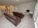 Expansive living room offering a comfortable seating area and a bright, airy ambiance at 3052 Living Coral Dr, Odessa, FL 33556