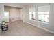 Bright living room featuring tile flooring, neutral paint, and two large windows; welcoming space at 3052 Living Coral Dr, Odessa, FL 33556