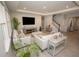 Bright living room with tile floors, recessed lighting, and a staircase nearby at 3052 Living Coral Dr, Odessa, FL 33556