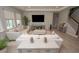 Spacious living room featuring tile floors, comfortable seating, and modern design elements at 3052 Living Coral Dr, Odessa, FL 33556