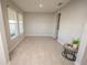 Bright and airy living room with tile floors and large windows at 3052 Living Coral Dr, Odessa, FL 33556