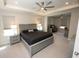 The primary bedroom boasts recessed lighting, a fan, and adjacent office space for convenience at 3052 Living Coral Dr, Odessa, FL 33556