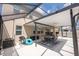 Covered, screened-in patio features a dining area and outdoor kitchen, perfect for entertaining and relaxing at 3052 Living Coral Dr, Odessa, FL 33556