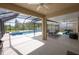 Screened patio with a pool and outdoor dining area, perfect for entertaining at 3052 Living Coral Dr, Odessa, FL 33556
