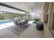 Covered patio with a view of a screened in pool, perfect for relaxing outdoors at 3052 Living Coral Dr, Odessa, FL 33556