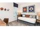 Sports-themed bedroom with daybed, playful wall decor, and natural light from the window at 33618 Castaway Loop, Wesley Chapel, FL 33543