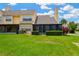 Exterior view of a two-story home with a screened-in patio and green lawn at 3602 Pine Knot Dr # 0, Valrico, FL 33596