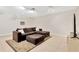Finished basement featuring a comfortable seating area with a sectional and entertainment setup at 3602 Pine Knot Dr # 0, Valrico, FL 33596