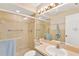 Bathroom with a glass-enclosed shower, tiled walls, and soft, neutral tones at 3602 Pine Knot Dr # 0, Valrico, FL 33596