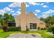 Charming home with a tall chimney, a screened patio, well-manicured lawn and designated parking at 3602 Pine Knot Dr # 0, Valrico, FL 33596