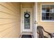 Charming front door with a decorative wreath and sidelight window at 3602 Pine Knot Dr # 0, Valrico, FL 33596
