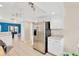 Bright kitchen with stainless steel refrigerator and an open view to a large living area at 3602 Pine Knot Dr # 0, Valrico, FL 33596