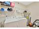 Functional laundry room with washer, dryer, water heater, and shelving at 3602 Pine Knot Dr # 0, Valrico, FL 33596