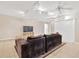 Spacious living room features neutral paint, tile flooring, and a ceiling fan at 3602 Pine Knot Dr # 0, Valrico, FL 33596