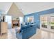 Bright living room features a cozy fireplace, vaulted ceilings, and blue accent wall at 3602 Pine Knot Dr # 0, Valrico, FL 33596