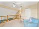 Upstairs loft area with a wood railing and natural light at 3602 Pine Knot Dr # 0, Valrico, FL 33596
