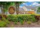 Community entrance sign amidst lush foliage at 3602 Pine Knot Dr # 0, Valrico, FL 33596