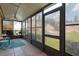 Sunroom featuring large tinted windows and seating area with rug at 3602 Pine Knot Dr # 0, Valrico, FL 33596