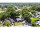 Overhead shot of a home in a tree-lined neighborhood, showing the yard and nearby streets at 3809 N 14Th St, Tampa, FL 33603