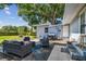 Cozy backyard patio with outdoor seating under a large, shady tree at 3809 N 14Th St, Tampa, FL 33603