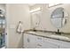 Bathroom featuring double sinks, modern faucets, vanity lighting, and granite countertops at 3809 N 14Th St, Tampa, FL 33603